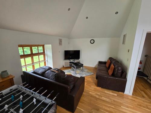 a living room with two couches and a tv at Naval base Quietness Parking LongStays 6Guests in Plymouth