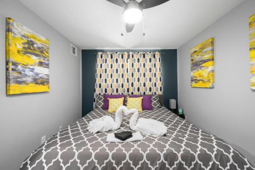 a bedroom with a large bed with two pillows at Stylish 1BR Apt - Steps from NRG and Texas Med Center in Houston