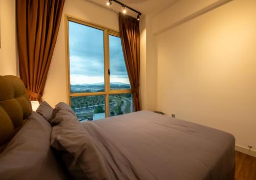 a bedroom with a bed and a large window at Afiniti 2BR - Giant Bear Home - Legoland 300m in Nusajaya