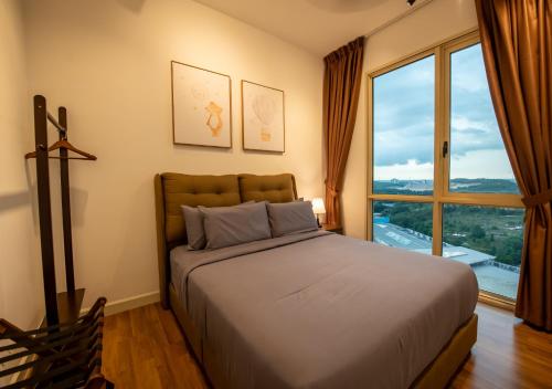 a bedroom with a large bed and a large window at Afiniti 2BR - Giant Bear Home - Legoland 300m in Nusajaya