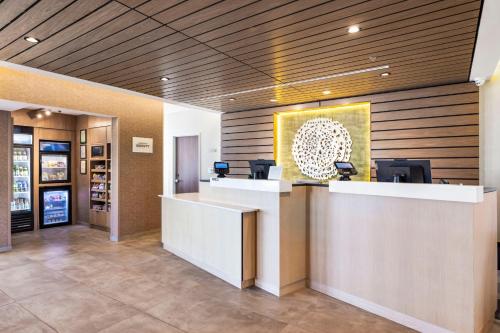 a lobby with a reception desk in a building at Fairfield by Marriott Inn & Suites San Francisco Airport Oyster Point Area in South San Francisco