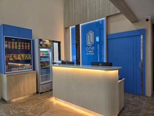 a convenience store with a refrigerator and a counter at One Budget Hotel Nan Pha Sing โรงแรม วัน บัดเจท น่าน ผาสิงห์ in Nan