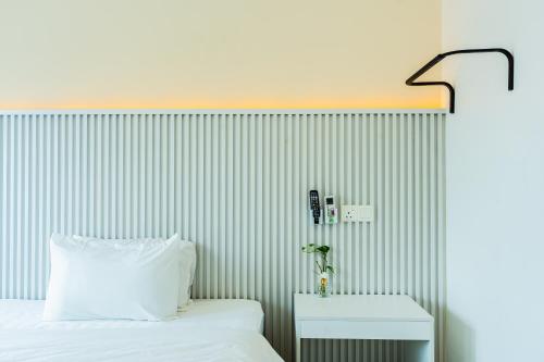 Кровать или кровати в номере Ihome Boutique Hotel