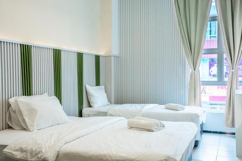 Кровать или кровати в номере Ihome Boutique Hotel