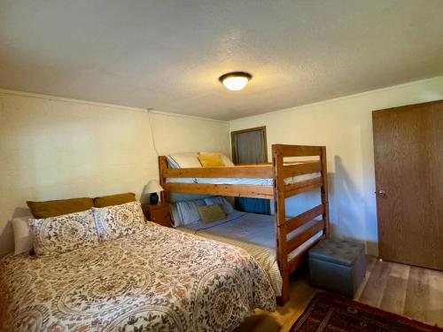 a bedroom with two bunk beds in a room at The Park Chalet by Casago McCall - Donerightmanagement in McCall