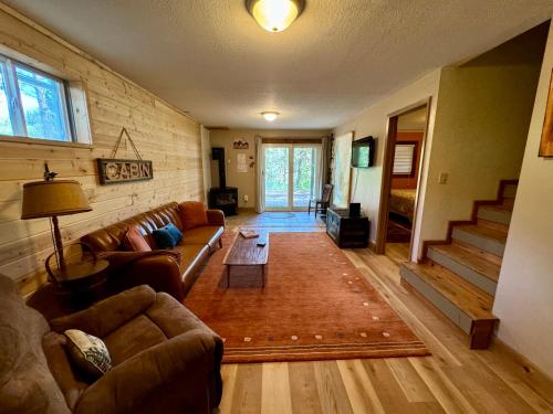 a living room with a couch and a table at The Park Chalet by Casago McCall - Donerightmanagement in McCall