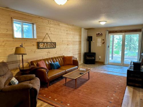 a living room with a couch and a table at The Park Chalet by Casago McCall - Donerightmanagement in McCall