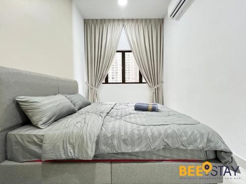 a bed in a bedroom with a window at Youth City Residence Family Suite KLIA AEON Mall Nilai USIM in Nilai