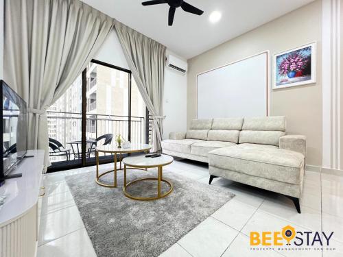 a living room with a couch and a table at Youth City Residence Family Suite KLIA AEON Mall Nilai USIM in Nilai
