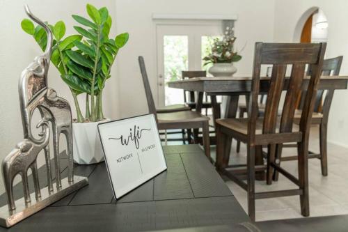 a dining room table with chairs and a sign on it at Large Family Home with Game Room in Page