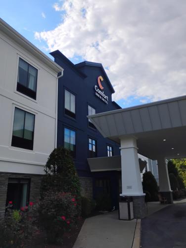 a blue and white building with a sign on it at Comfort Inn & Suites Tunkhannock in Tunkhannock