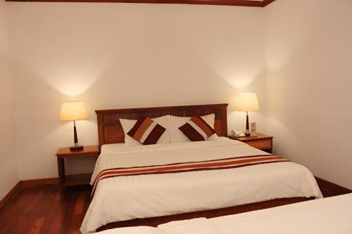 Postel nebo postele na pokoji v ubytování Cheathata CTS Hotel Siem Reap