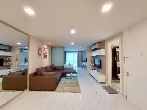 a large living room with a couch and a television at Condominium - Sukhumvit Soi 5 BTS Nana- Room Size 47m2 in Bangkok
