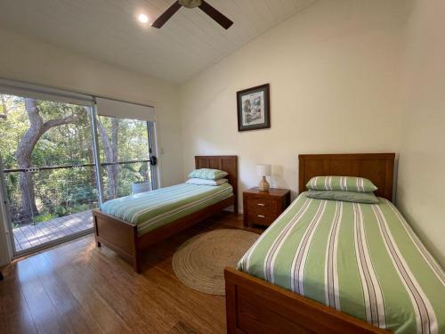 Postel nebo postele na pokoji v ubytování Pandanus