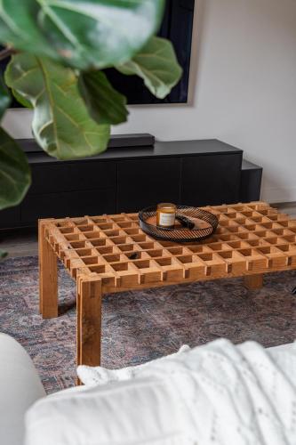 a wooden coffee table in a living room at Pulaski Point Properties in Chicago