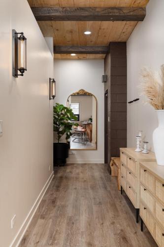 a hallway with wood floors and a mirror at Pulaski Point Properties in Chicago