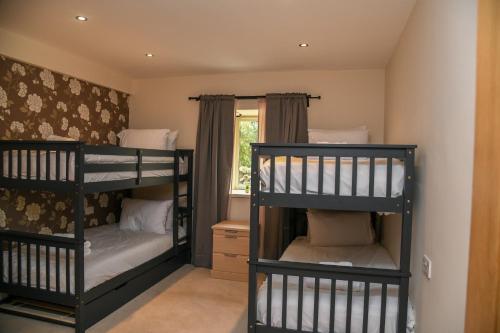 Voodi või voodid majutusasutuse Ridgeway Cottage at Lovelady Shield toas