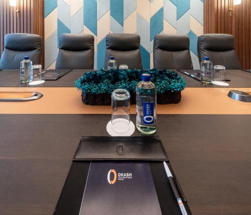 a bottle of water sitting on top of a table at Okash City Boutique Hotel in Nairobi