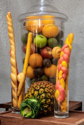 a jar filled with fruits and vegetables on a table at Okash City Boutique Hotel in Nairobi