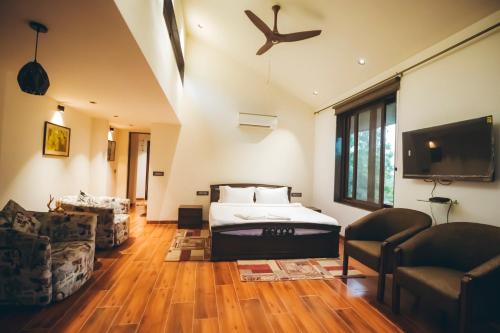 Ένα ή περισσότερα κρεβάτια σε δωμάτιο στο Red River Bungalow