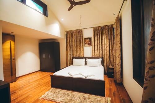 Ένα ή περισσότερα κρεβάτια σε δωμάτιο στο Red River Bungalow