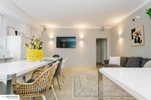 a living room with a table and a couch at YOUPARTMENTS - zentrale Micro Apartments in Kaiserslautern
