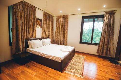 Ένα ή περισσότερα κρεβάτια σε δωμάτιο στο Red River Bungalow