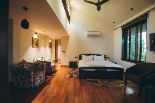 Ένα ή περισσότερα κρεβάτια σε δωμάτιο στο Red River Bungalow