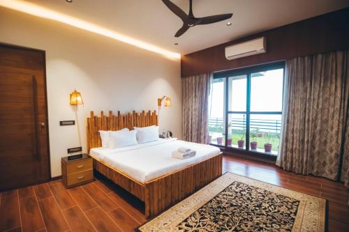Ένα ή περισσότερα κρεβάτια σε δωμάτιο στο Red River Bungalow
