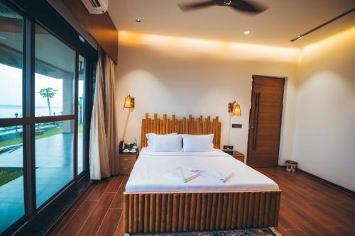 Ένα ή περισσότερα κρεβάτια σε δωμάτιο στο Red River Bungalow