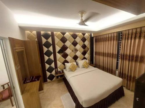a bedroom with a bed in a room at Resort Beach View in Cox's Bazar