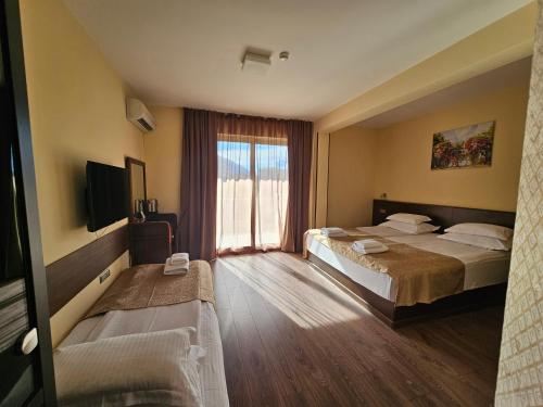 Postel nebo postele na pokoji v ubytování Hotel Premier