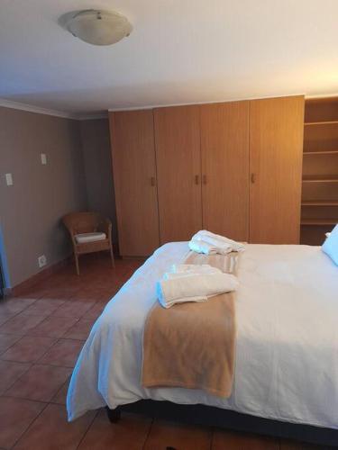 a bedroom with a bed with two pillows on it at Breakers Edge in Bay View