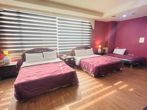 Ένα ή περισσότερα κρεβάτια σε δωμάτιο στο Garden Business Hotel