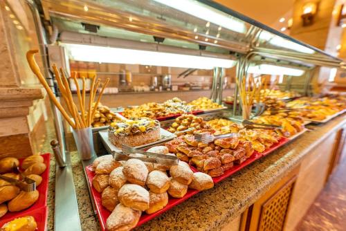 a buffet line with many different types of pastries at Akassia Swiss Resort in Quseir