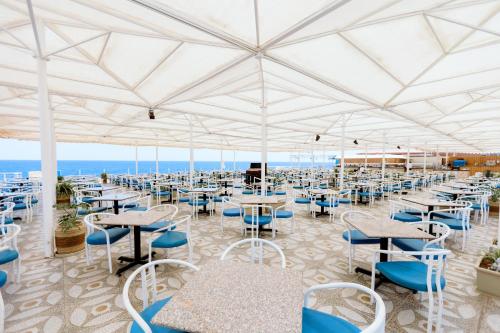 a large white tent with tables and chairs at Akassia Swiss Resort in Quseir