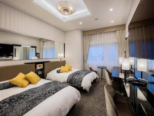 En eller flere senge i et værelse på APA Hotel Asakusa Tawaramachi Ekimae