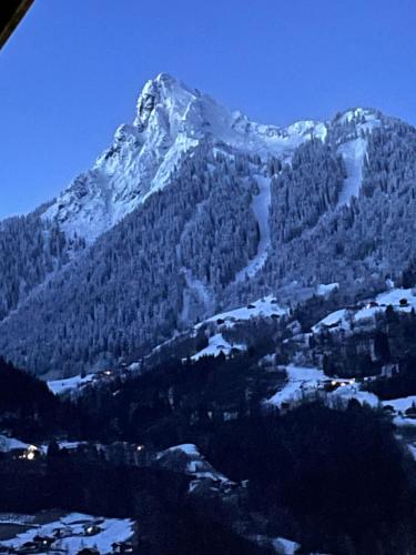 a mountain with a snow covered mountain at Apartment Sonnenlicht in Schruns-Tschagguns