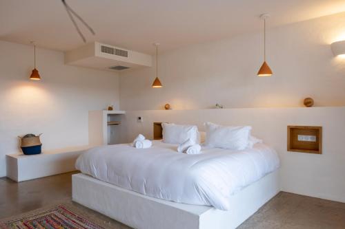 Postel nebo postele na pokoji v ubytování VILLA FLAKA Boutique Hôtel Confidentiel et Convivial