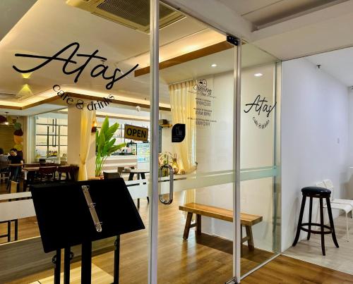 a store window with a sign that says airify at C Y C Heritage Hotel in George Town