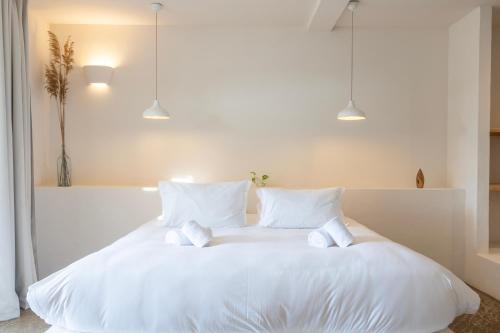 Postel nebo postele na pokoji v ubytování VILLA FLAKA Boutique Hôtel Confidentiel et Convivial