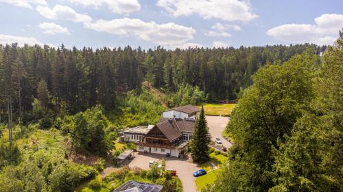 an aerial view of a house in the woods at Waldhotel Ehrental in Schmalkalden