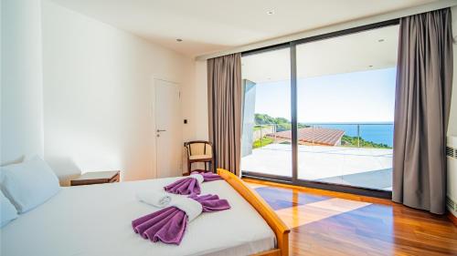 Ένα ή περισσότερα κρεβάτια σε δωμάτιο στο Villa Harizma
