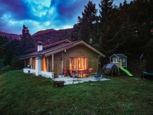 a small house with a tent in a field at Chalet Khione in La Tzoumaz