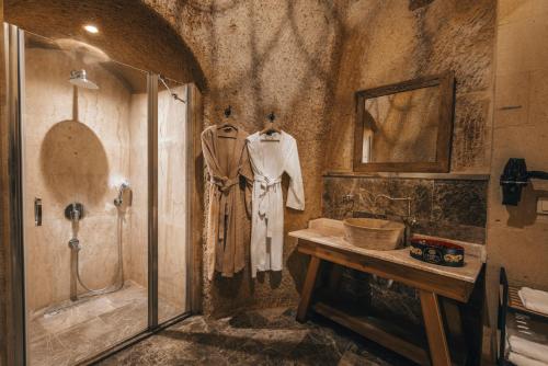 a bathroom with a shower and a sink at Harem Suites Cappadocia in Uchisar