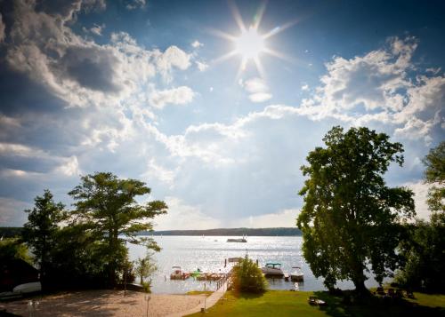 a view of a lake with boats in the water at Hotel Resort Märkisches Meer in Diensdorf-Radlow