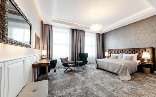 Postel nebo postele na pokoji v ubytování Grandhotel Brno