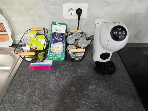 a hair dryer sitting on a counter next to some food at GOLDEN OASIS Free Private Parking in Ljubljana