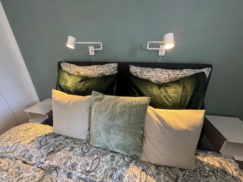 a bedroom with a bed with pillows on it at FoRest House in Rosenfors