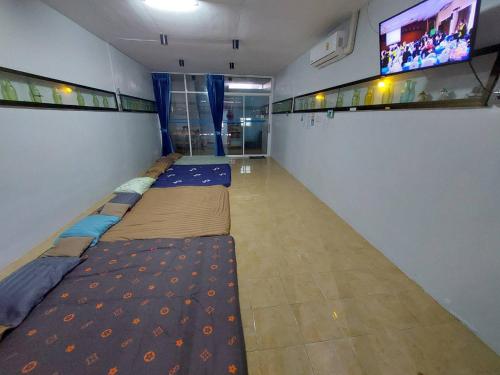 Katil atau katil-katil dalam bilik di Classic 8 Home Stay Hatyai